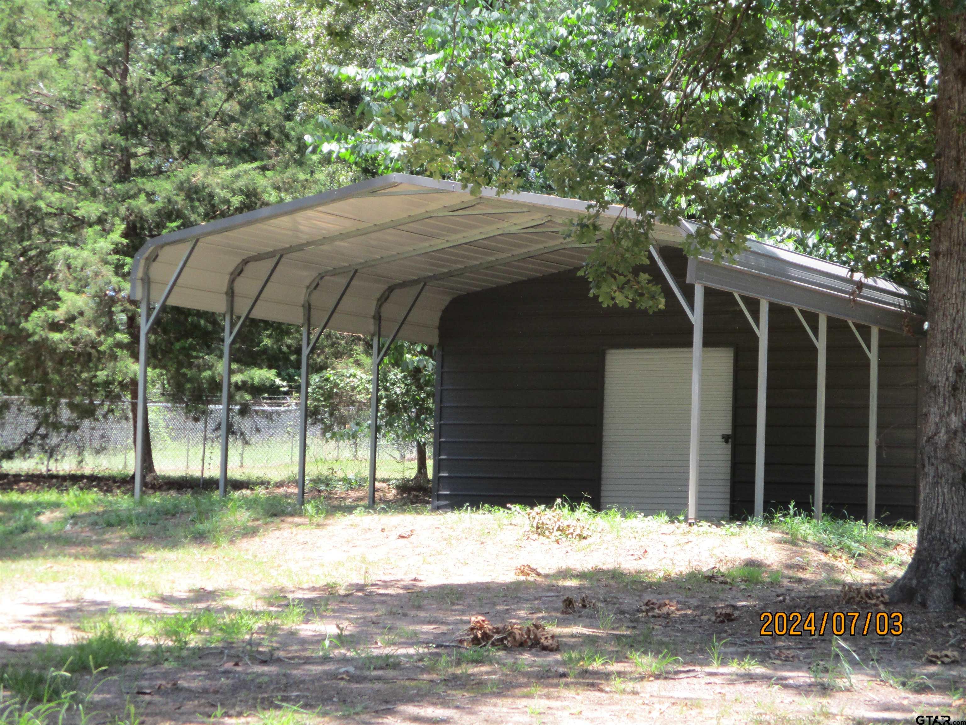 105 Sioux Lane Longview, TX 75603 - Photo 6 of 22 a view of a wooden house with a yard
