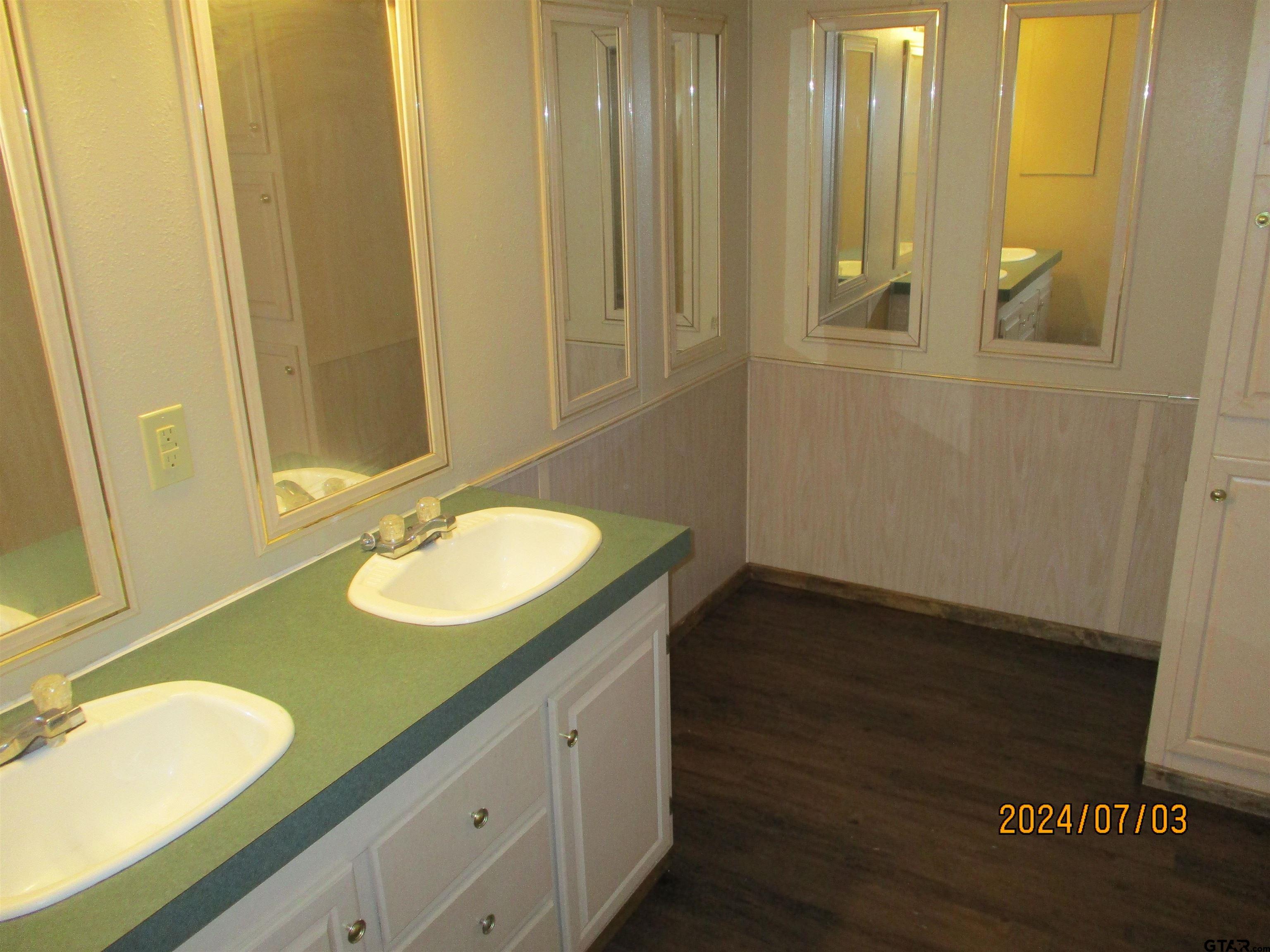 105 Sioux Lane Longview, TX 75603 - Photo 9 of 22 a bathroom with a sink and a mirror