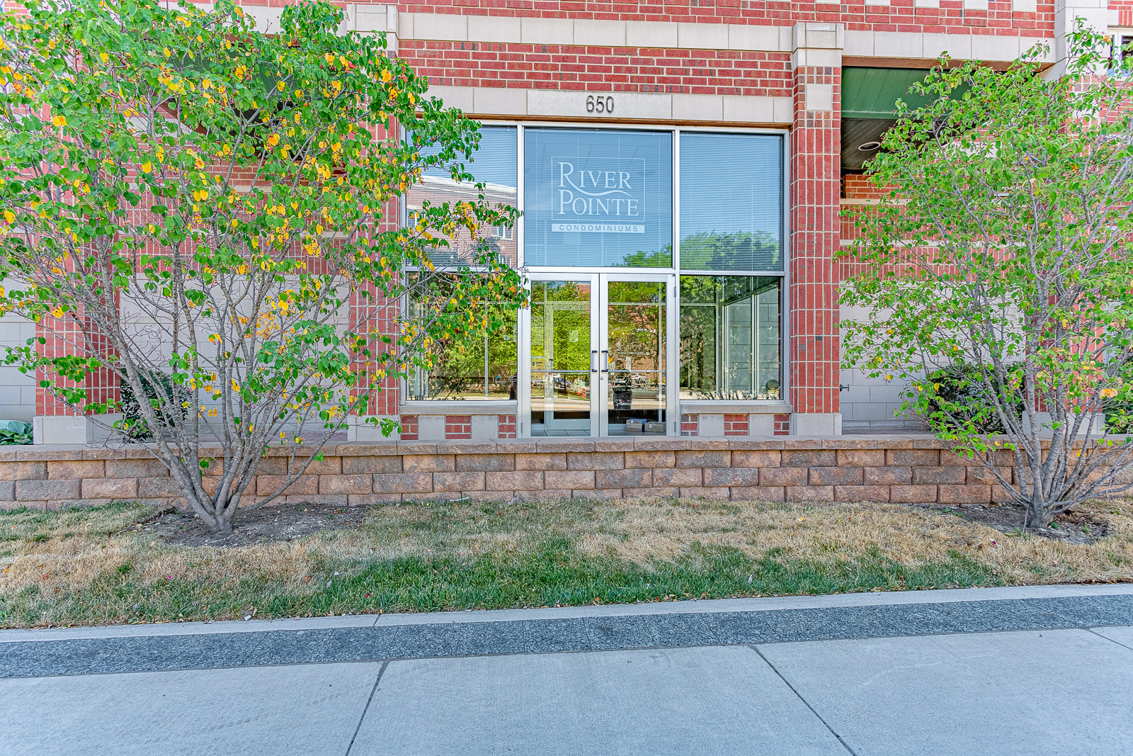 650 South River Road, Unit 807 Des Plaines, IL 60016 - Photo 1 of 16 a front view of a house with garden