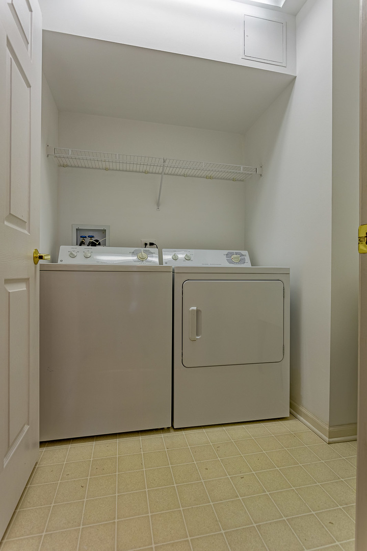 650 South River Road, Unit 807 Des Plaines, IL 60016 - Photo 11 of 16 a utility room with dryer and washer