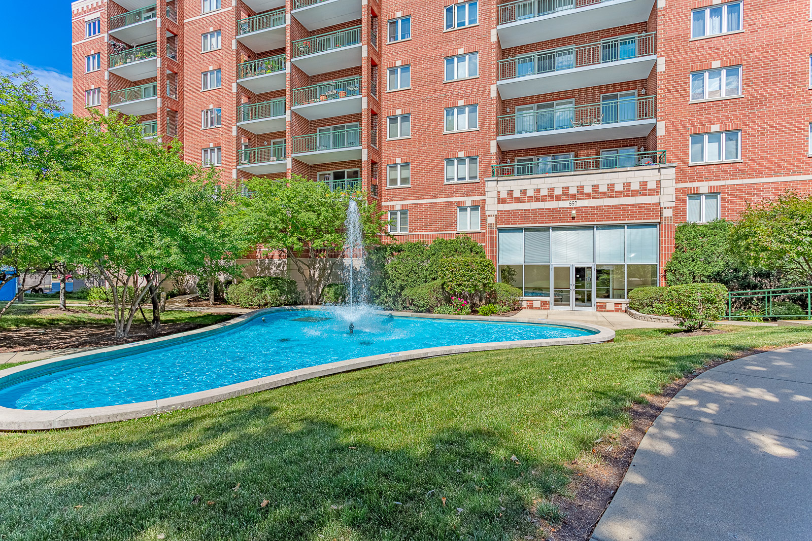650 South River Road, Unit 807 Des Plaines, IL 60016 - Photo 14 of 16 a front view of building with yard