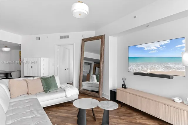 a kitchen with sink and refrigerator