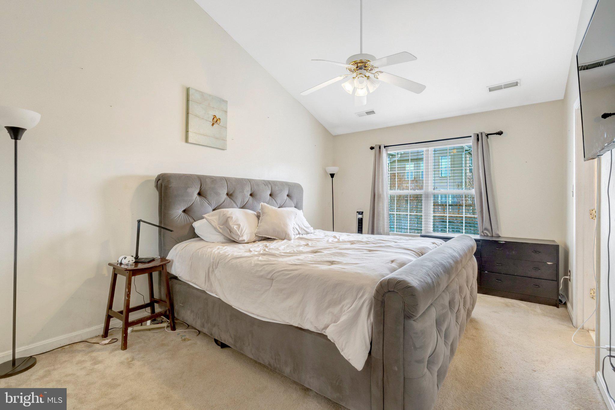 42888 Golf View Drive Chantilly, VA 20152 - Photo 19 of 29 a spacious bedroom with a bed and a dresser
