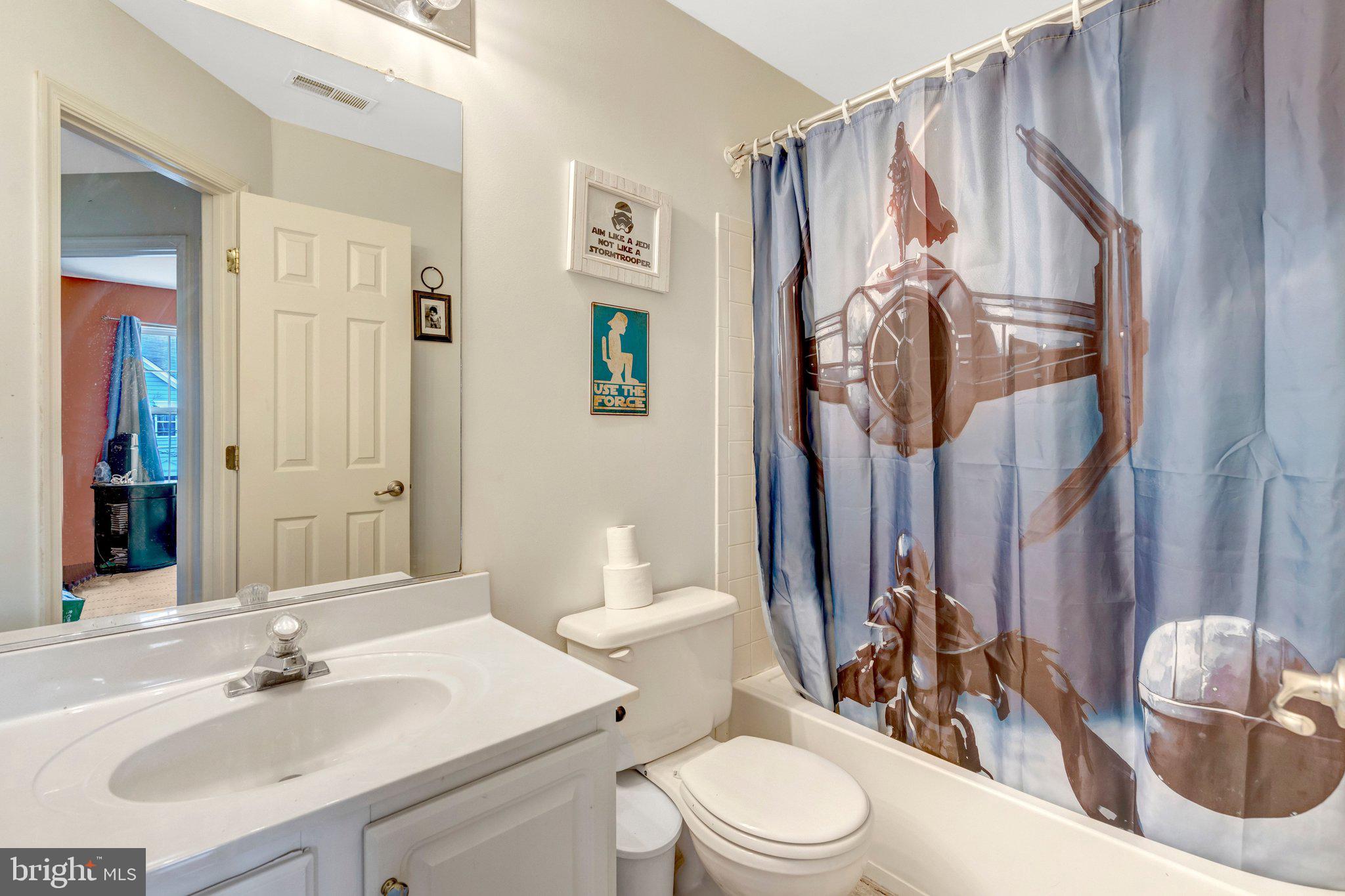 42888 Golf View Drive Chantilly, VA 20152 - Photo 27 of 29 a bathroom with a sink vanity mirror and toilet