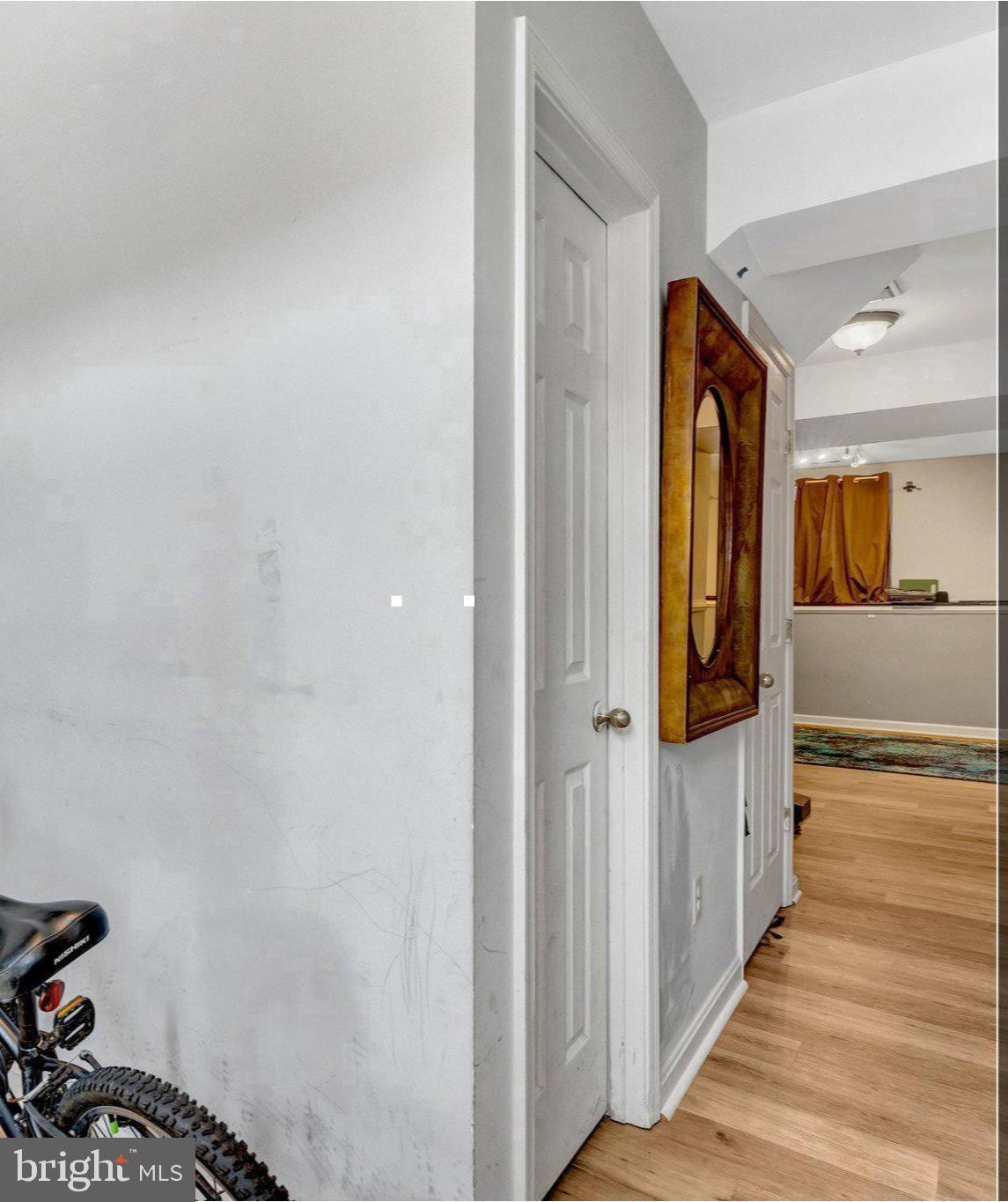 42888 Golf View Drive Chantilly, VA 20152 - Photo 3 of 29 a view of a hallway with wooden floor and staircase