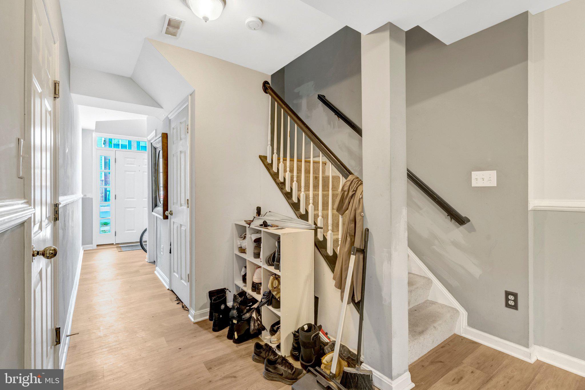 42888 Golf View Drive Chantilly, VA 20152 - Photo 8 of 29 a view of a hallway with wooden floor and staircase