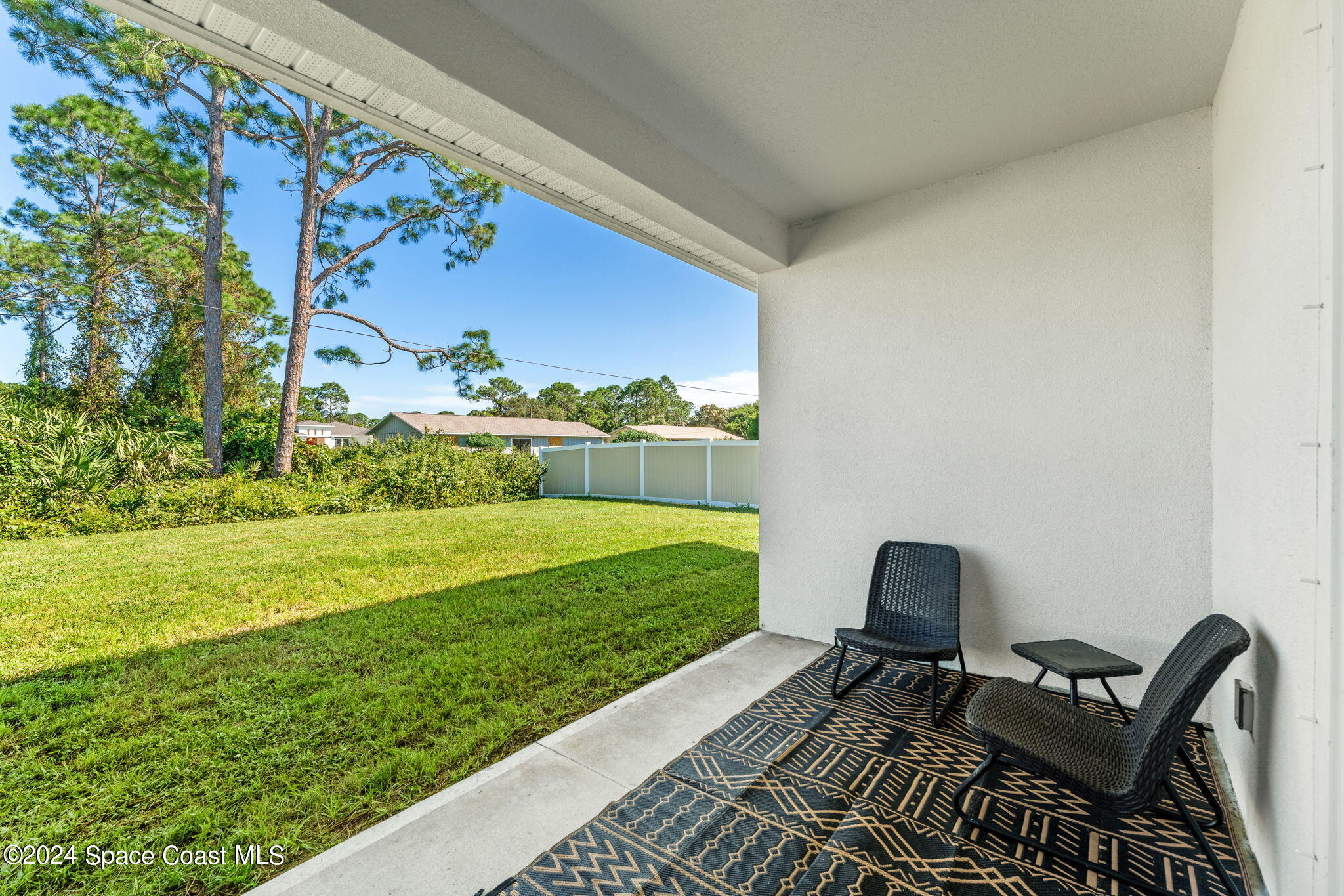 355 Wendover Road Southwest Palm Bay, FL 32908 - Photo 27 of 44 a view of a two chairs in the garden