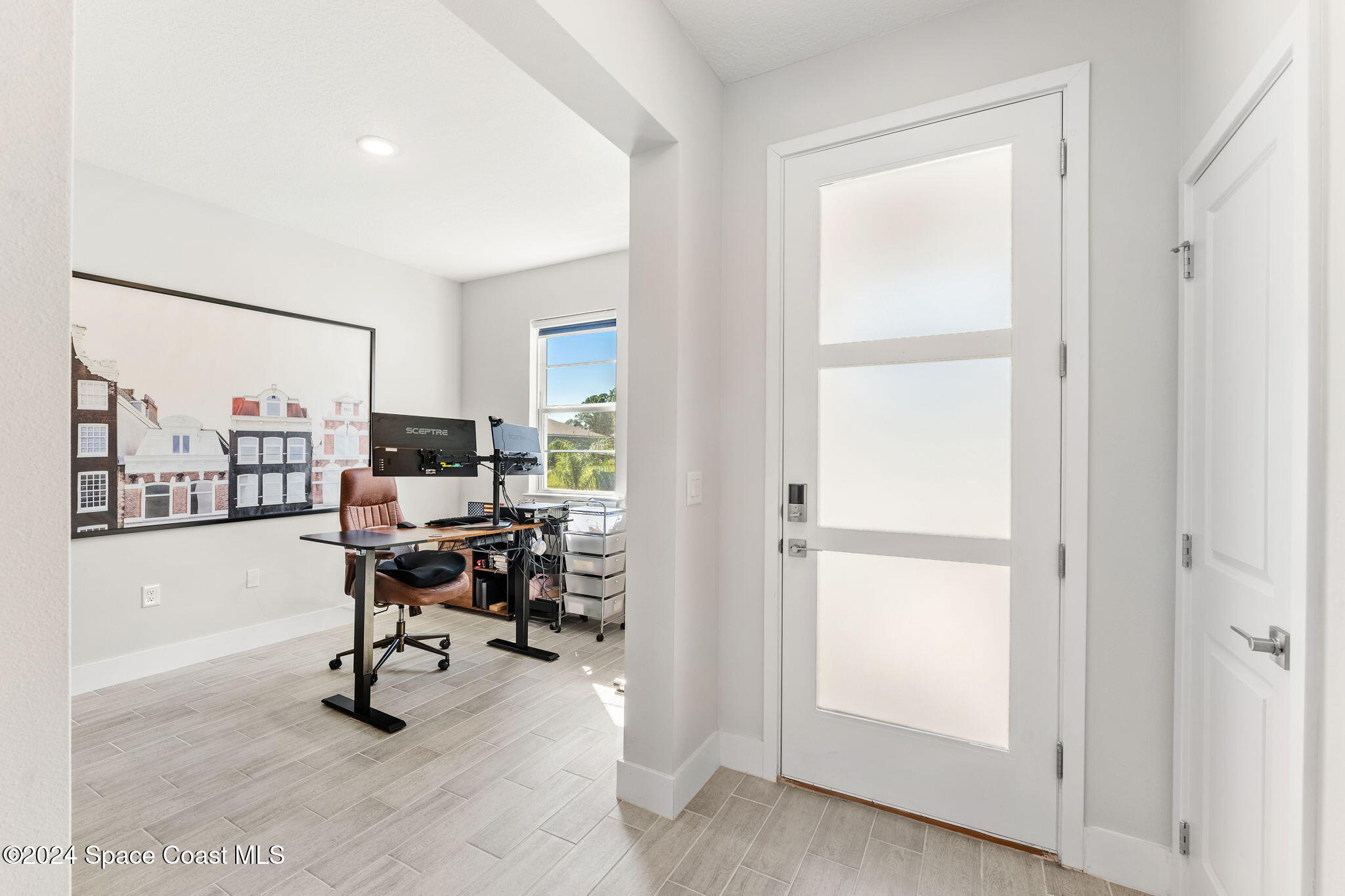 355 Wendover Road Southwest Palm Bay, FL 32908 - Photo 3 of 44 a view of a workspace with furniture and a window