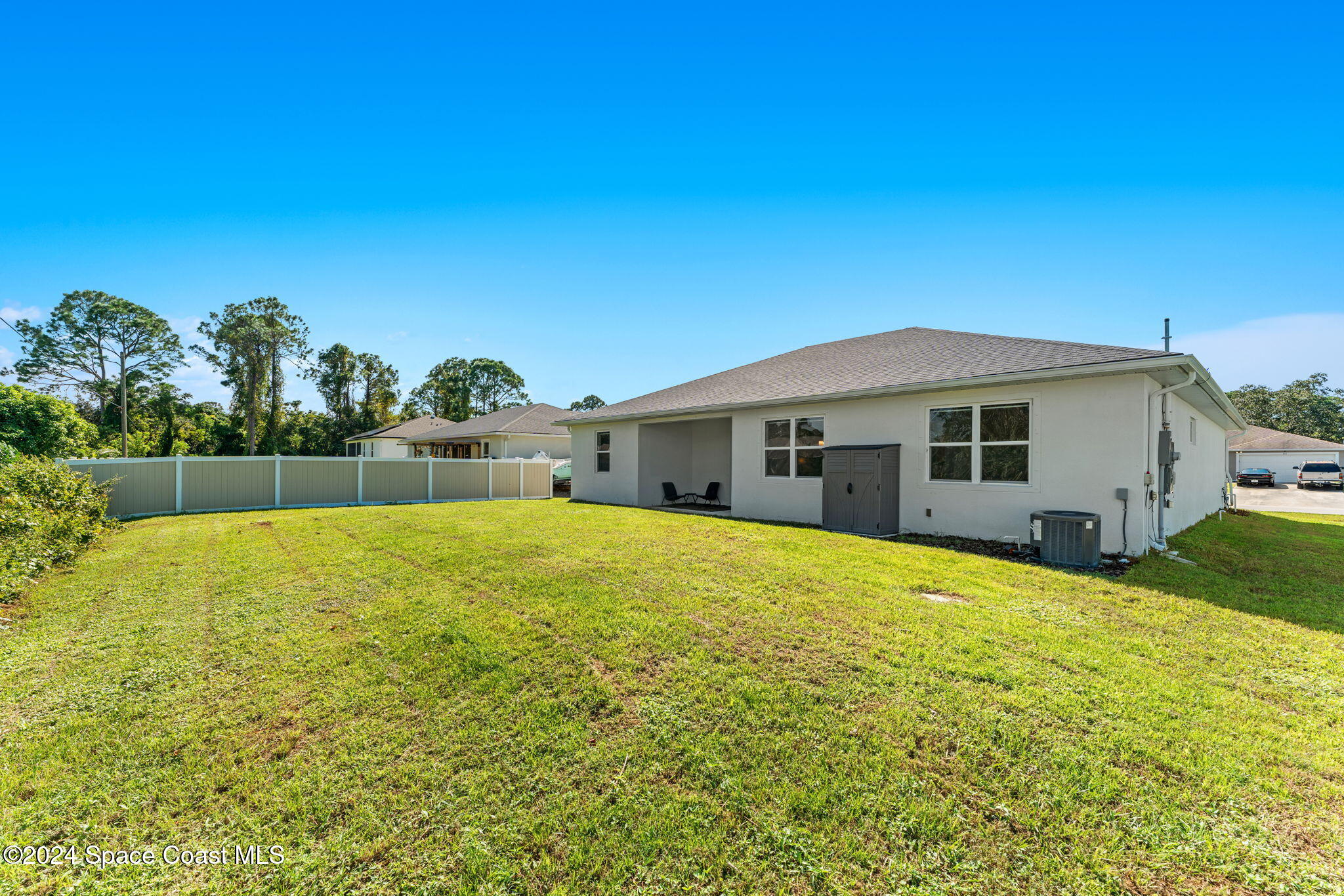 355 Wendover Road Southwest Palm Bay, FL 32908 - Photo 30 of 44 a view of a house with backyard and garden