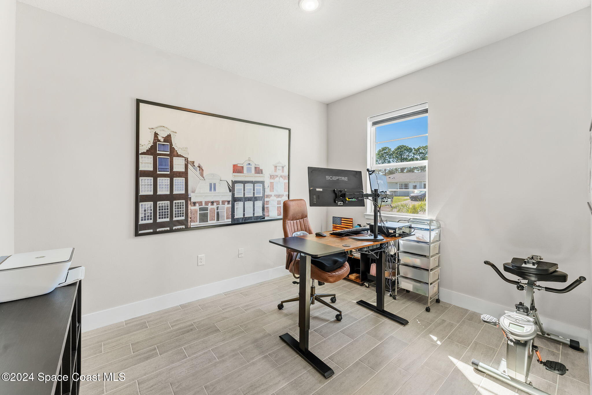 355 Wendover Road Southwest Palm Bay, FL 32908 - Photo 4 of 44 a view of a workspace with furniture and a window