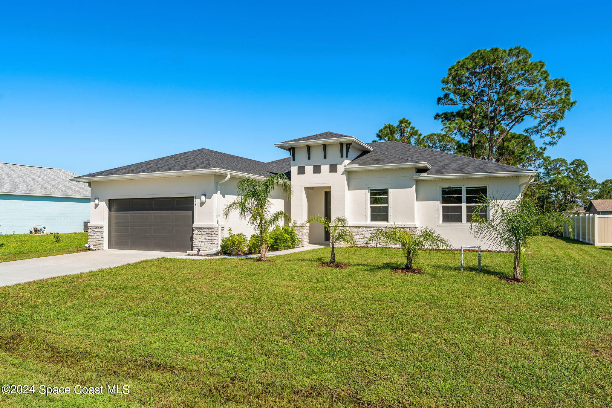 355 Wendover Road Southwest Palm Bay, FL 32908 - Photo 42 of 44 a front view of a house with a yard and porch