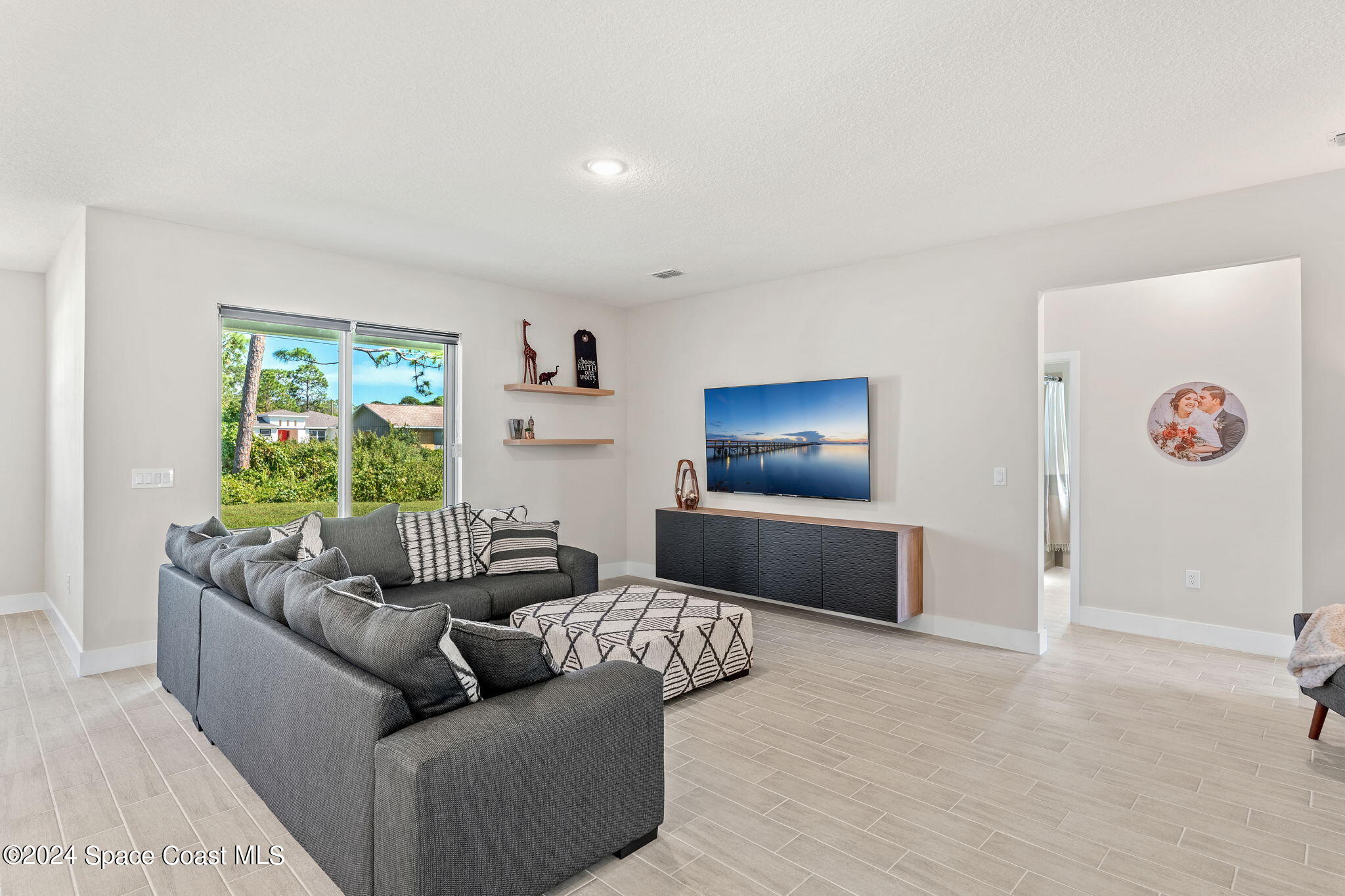 355 Wendover Road Southwest Palm Bay, FL 32908 - Photo 8 of 44 a living room with furniture and a window