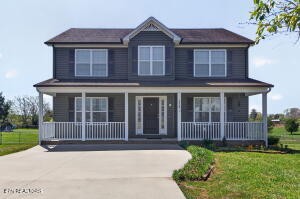 338 Pistole Road Sparta, TN 38583 - Photo 1 of 39 a view of brick house with large windows and a small yard