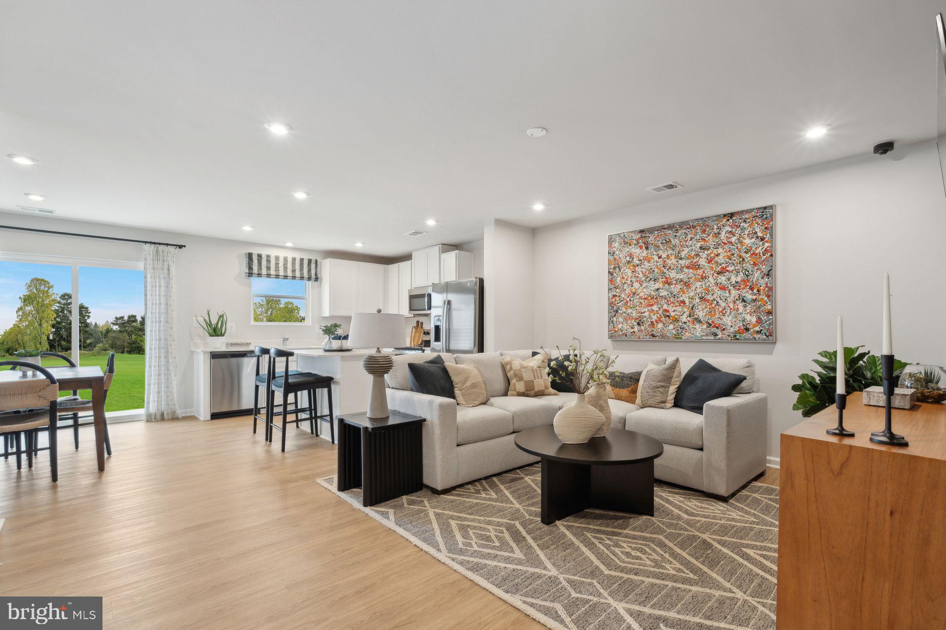 240 Olympus Road Charles Town, WV 25414 - Photo 3 of 22 a living room with furniture dining area and a table