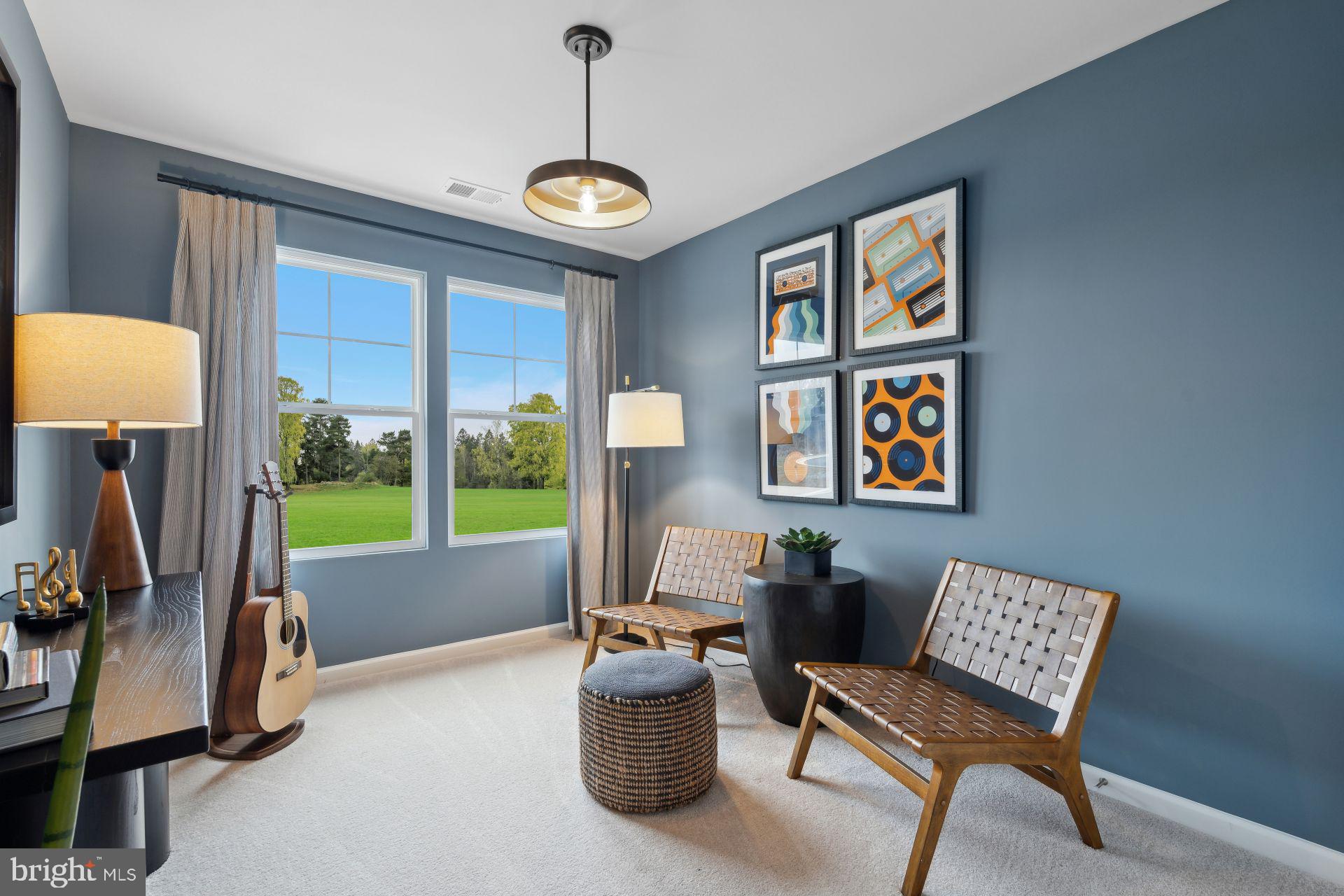 240 Olympus Road Charles Town, WV 25414 - Photo 6 of 22 a living room with furniture and a floor to ceiling window