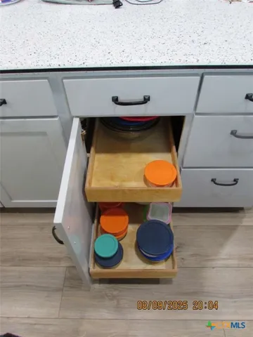 a view of a a dining room with furniture window and wooden floor