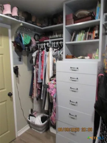 a utility room with dryer and window