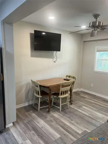 a bed sitting in a bedroom and a mirror