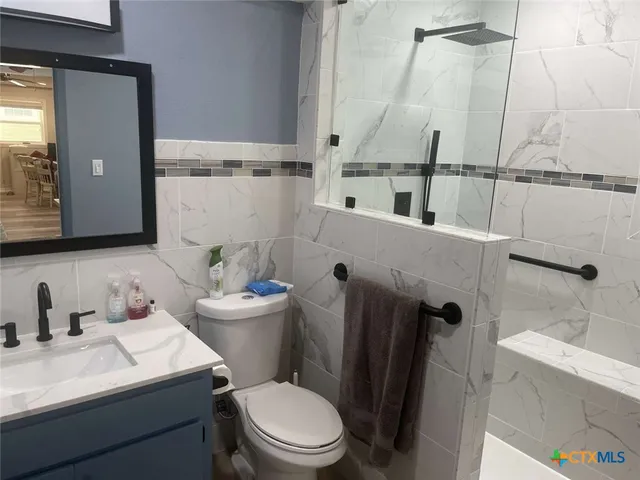 a bedroom with a bed and with furniture