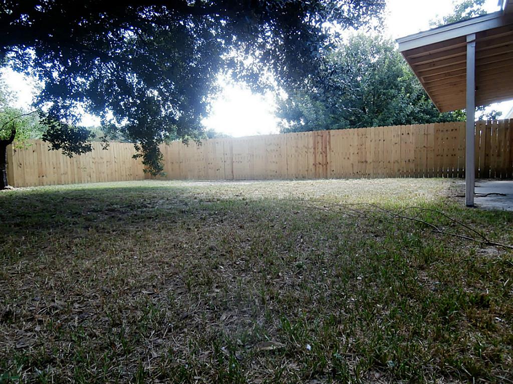10011 Appleridge Drive Houston, TX 77070 - Photo 35 of 48 a view of backyard with tree