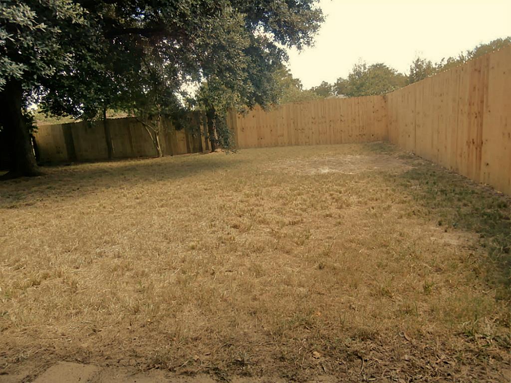 10011 Appleridge Drive Houston, TX 77070 - Photo 36 of 48 a view of a yard with a house