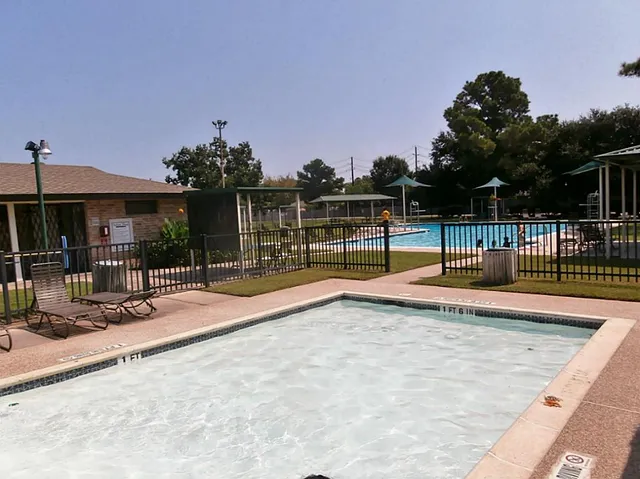 a view of a house with backyard porch and sitting area