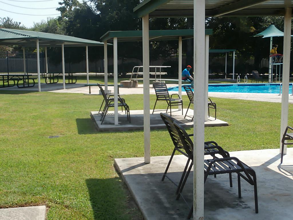 10011 Appleridge Drive Houston, TX 77070 - Photo 42 of 48 a swimming pool with outdoor seating and yard
