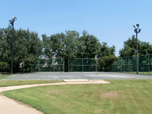a view of a field with a view of mountains