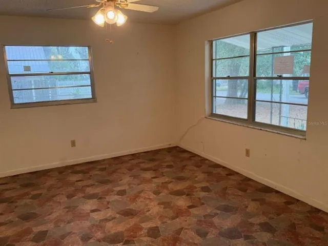 a kitchen with stainless steel appliances granite countertop a refrigerator stove and sink