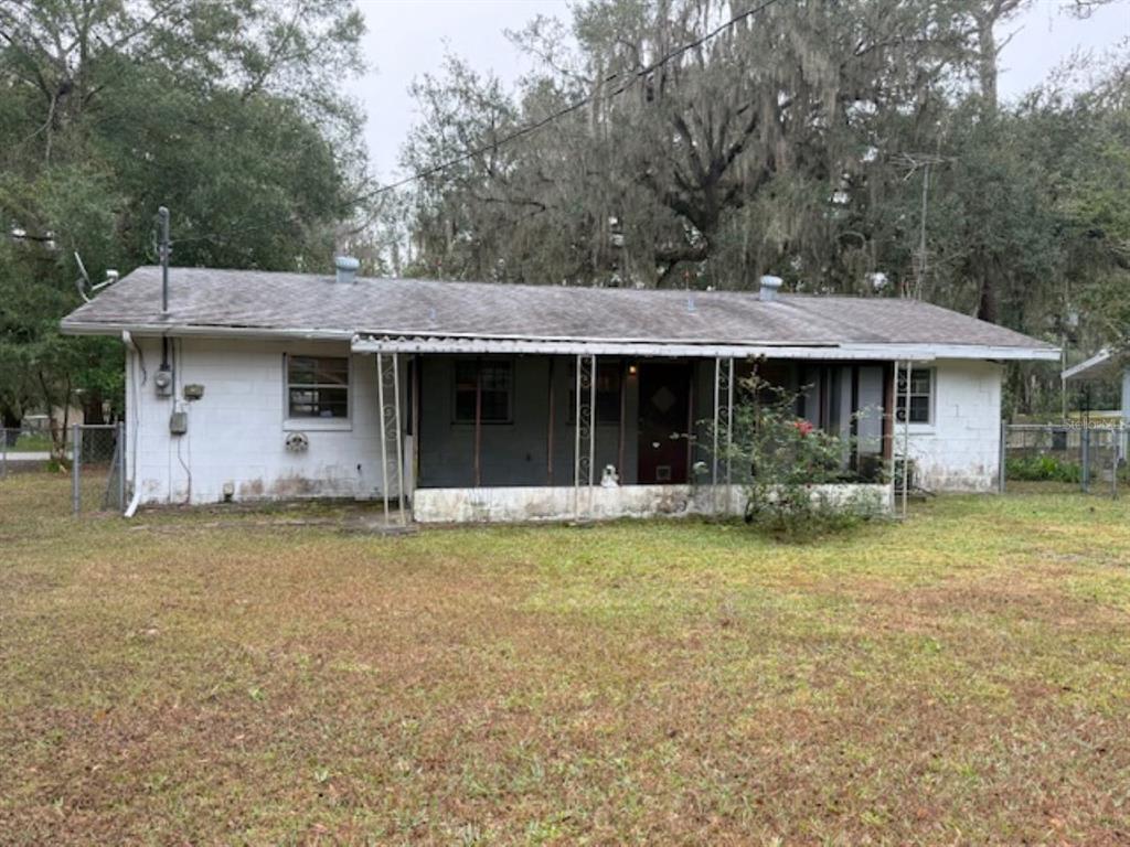 5737 Southeast Babb Road Belleview, FL 34420 - Photo 10 of 11 a view of a house with a yard and sitting area