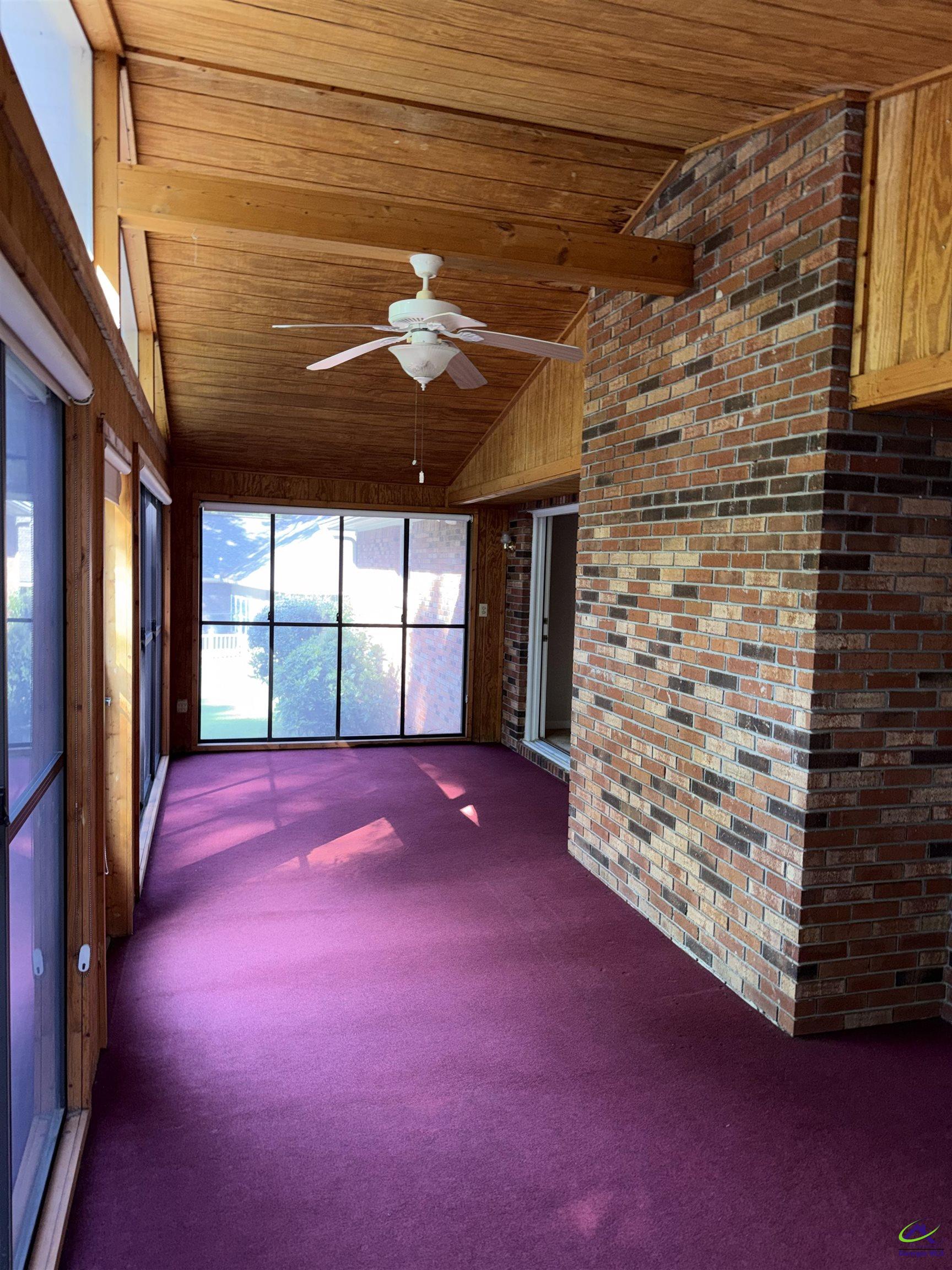 249 Hatcher Road Warner Robins, GA 31088 - Photo 20 of 25 a view of an empty room with windows and chandelier