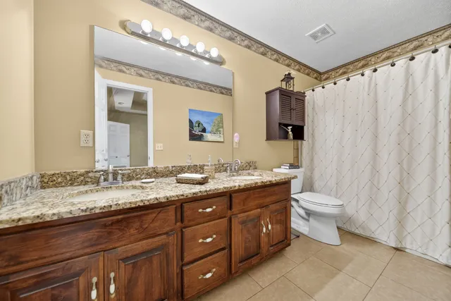 a bed room with a bed and a chandelier