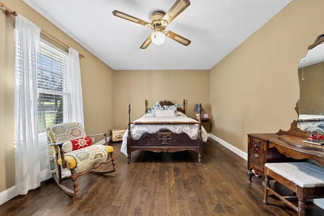 a bedroom with bed and window