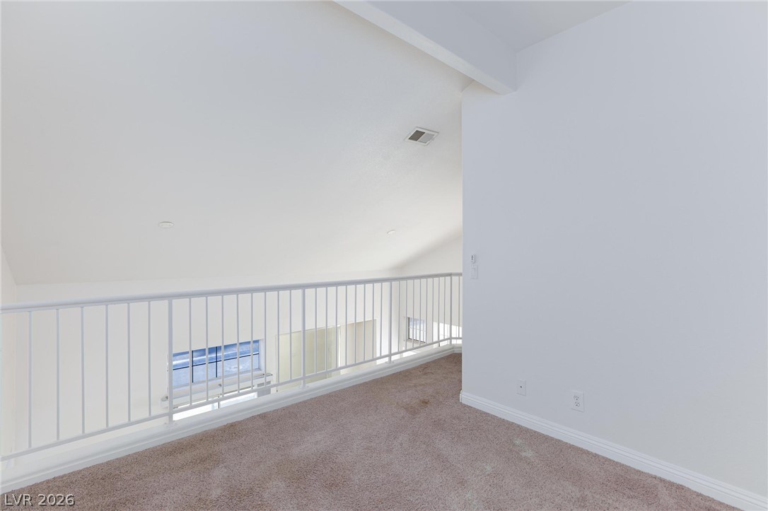 2246 Ramsgate Drive Henderson, NV 89074 - Photo 13 of 36 An airy loft area overlooks the lower level, providing an additional versatile space.