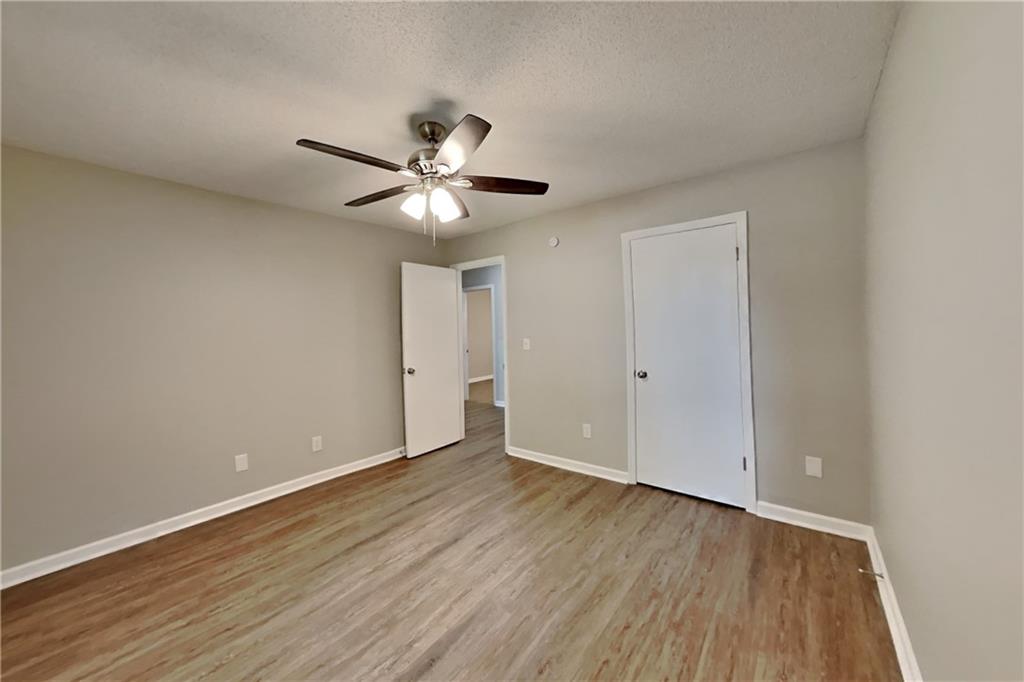 3883 Nowlin Road Kennesaw, GA 30144 - Photo 16 of 21 a view of an empty room with wooden floor