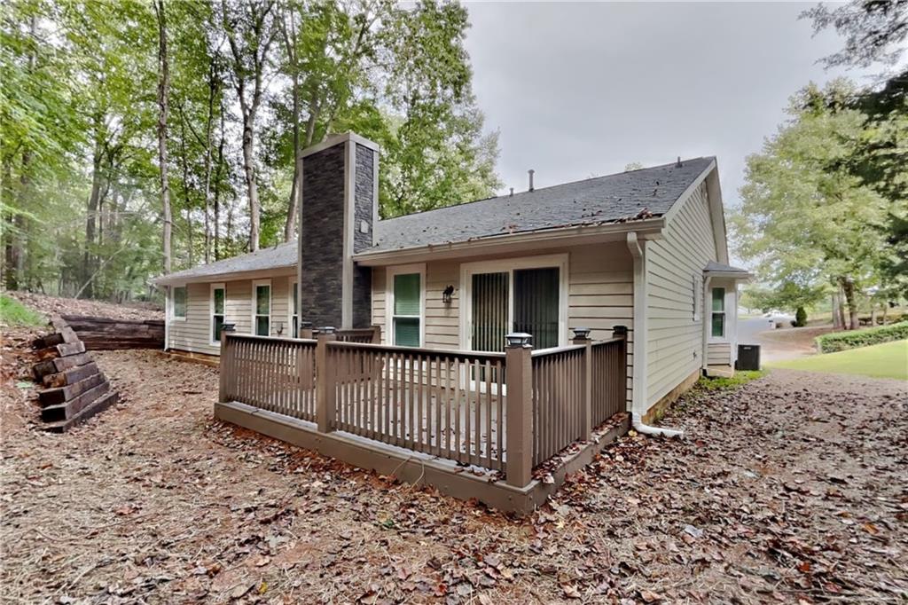 3883 Nowlin Road Kennesaw, GA 30144 - Photo 20 of 21 a front view of a house with a garden
