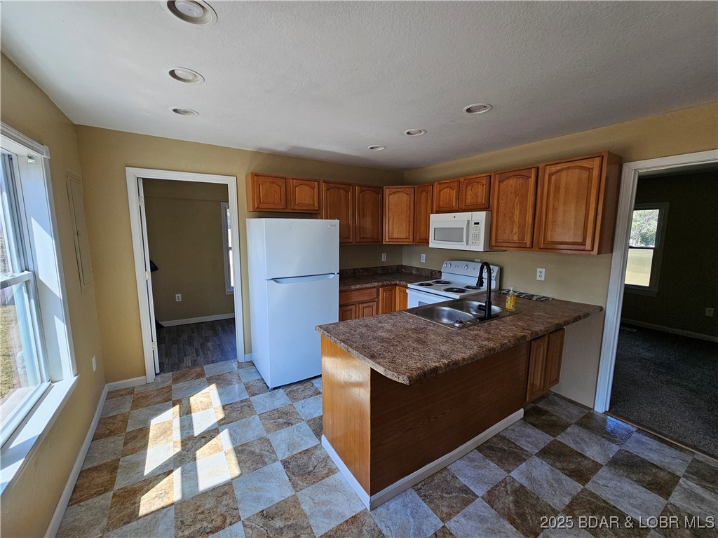 5560 Upper Prairie Hollow Road Macks Creek, MO 65786 - Photo 3 of 18 Kitchen w/dining area to utility room