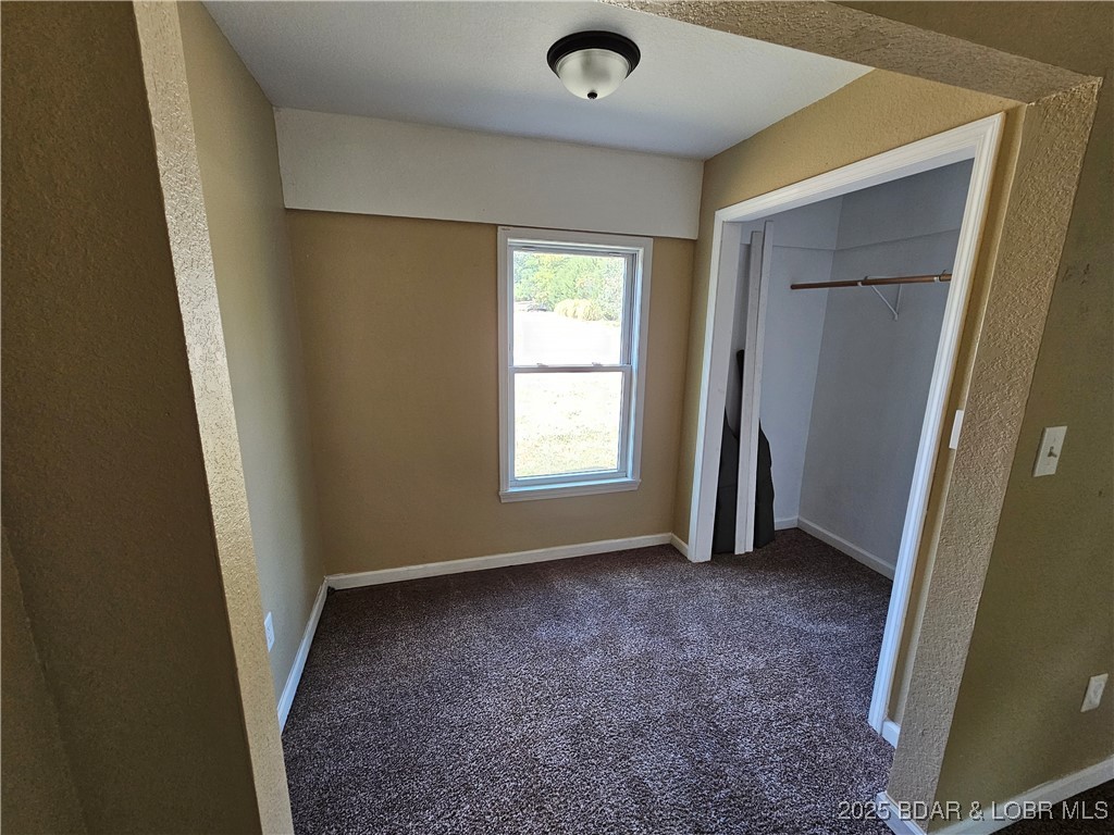 5560 Upper Prairie Hollow Road Macks Creek, MO 65786 - Photo 10 of 18 Walk in closet/sitting area bedroom 1