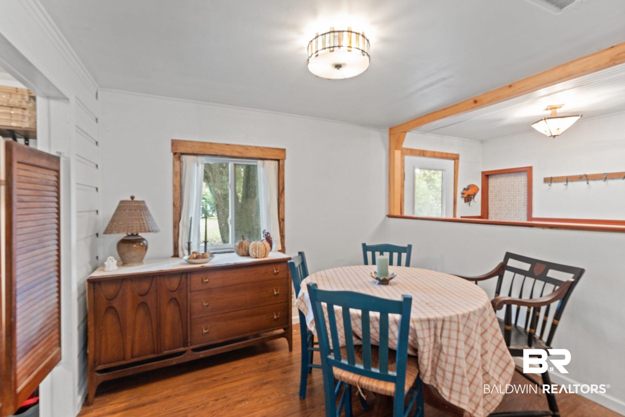 10785 Gregg Road Semmes, AL 36575 - Photo 13 of 35 Dining area with healthy amount of natural light and light wood-style floors