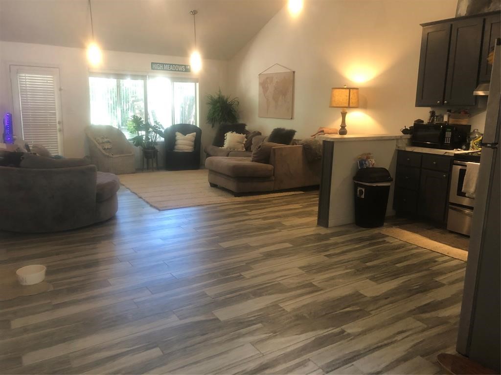 2904 Old Houston Road, Unit 7 Huntsville, TX 77340 - Photo 2 of 19 a living room with furniture window and wooden floor