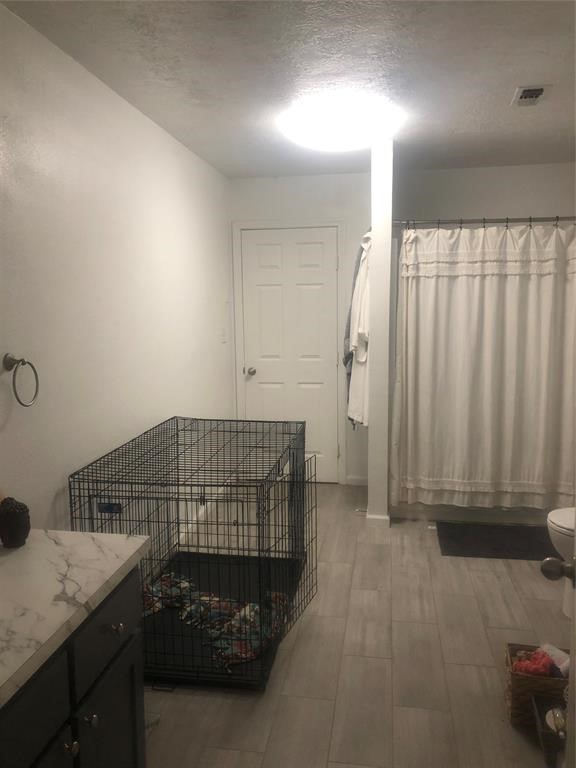 2904 Old Houston Road, Unit 7 Huntsville, TX 77340 - Photo 9 of 19 a bedroom with a bed and a window