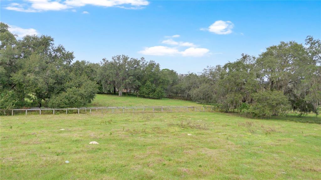 0 Rolling Acres Road Fruitland Park, FL 34731 - Photo 27 of 28 a view of a green field