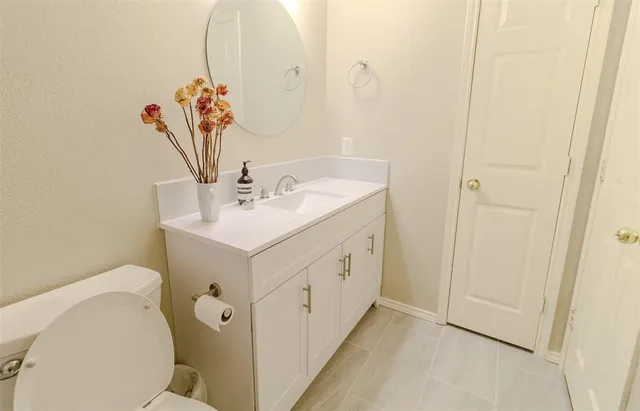 a kitchen with stainless steel appliances granite countertop a stove a sink a refrigerator and island