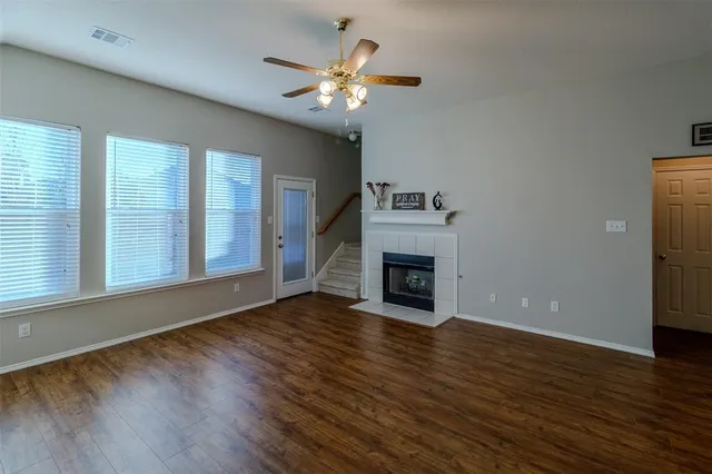 an empty room with a empty space and windows