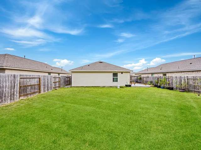 a view of a backyard of the house