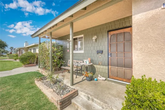 a bath room with a table and a chair