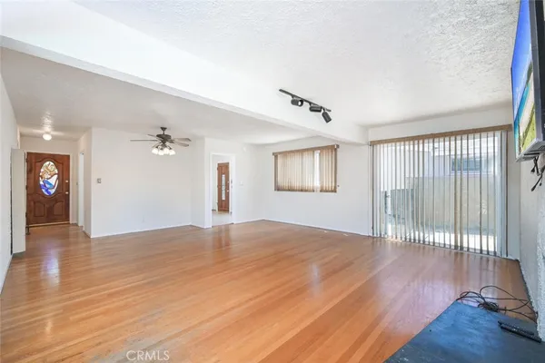 a view of a big room with wooden floor and closet