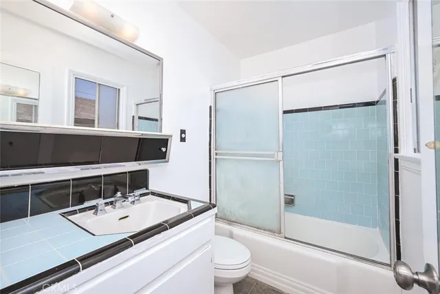 a bathroom with a bathtub and shower