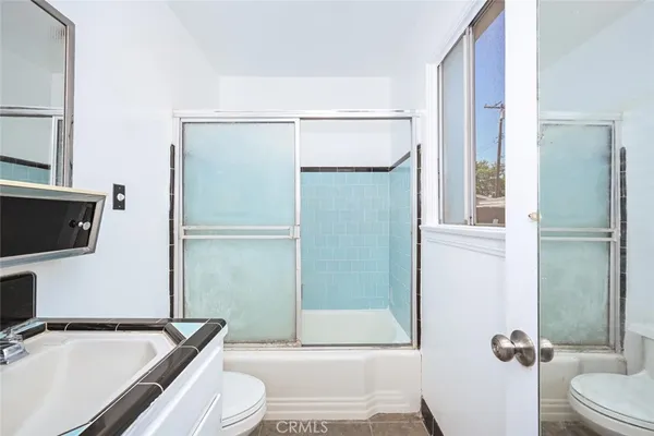 a bathroom with a bathtub and a sink