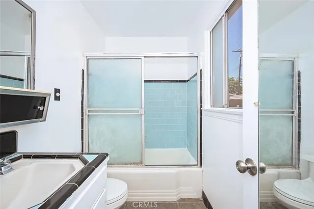 a bathroom with a bathtub and a sink